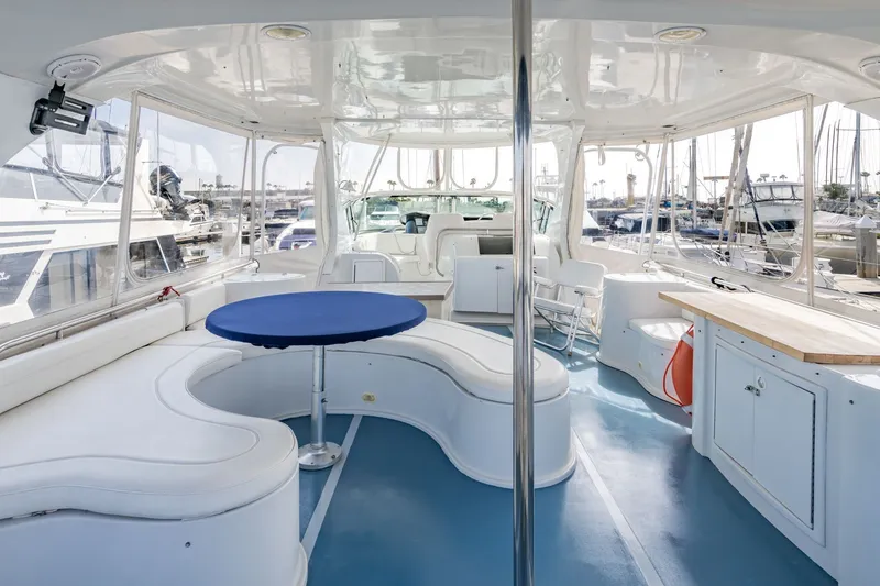 Slide: The Image of Spacious interior of 2003 Bluewater Yachts Custom 6000 with seating and table. - 11