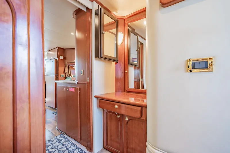 Slide: The Image of Luxurious interior of 2003 Bluewater Yachts Custom 6000 with elegant wood finishes. - 64