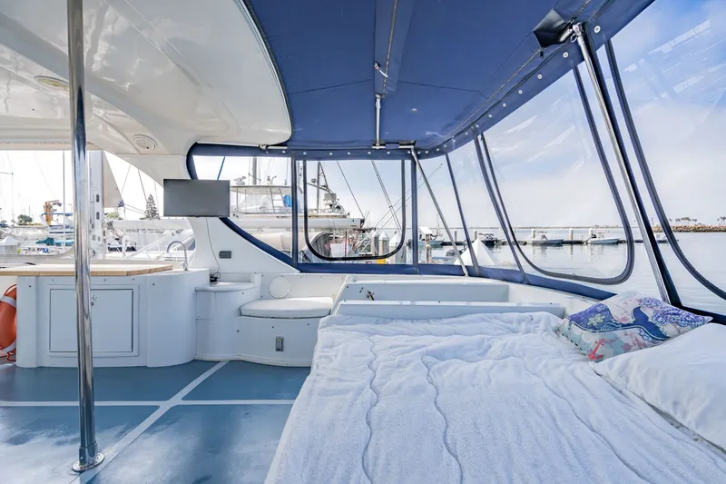 Slide: The Image of Luxurious interior of 2003 Bluewater Yachts Custom 6000 with panoramic marina views. - 13