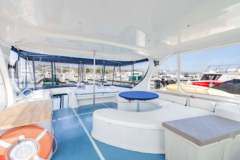 Slide: The Image of Spacious interior of 2003 Bluewater Yachts Custom 6000 with marina view. - 5