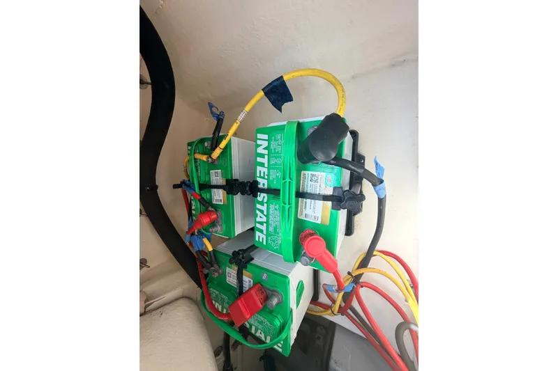 Slide: The Image of Battery setup in a 2016 Chaparral 250 Suncoast boat, featuring Interstate batteries. - 31