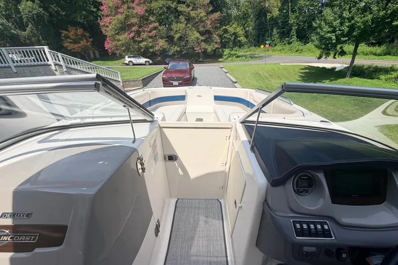 Slide: The Image of 2016 Chaparral 250 Suncoast boat interior with dashboard and seating area. - 17