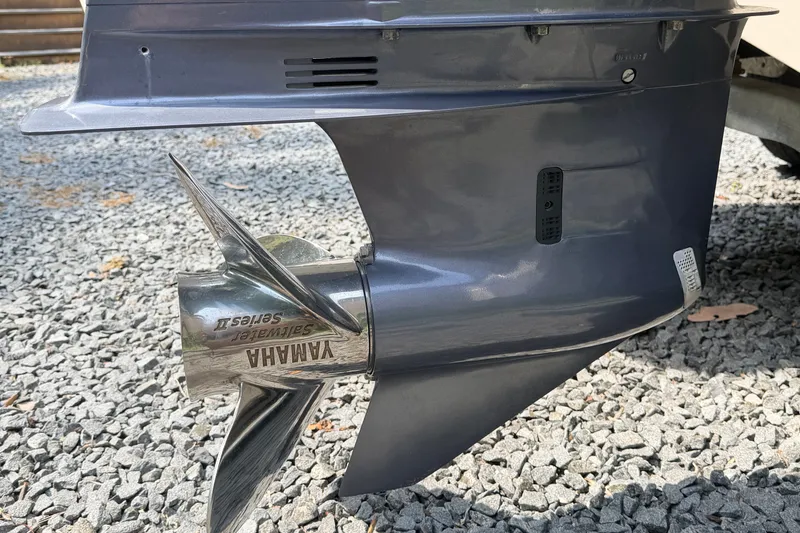 Slide: The Image of Yamaha Saltwater Series II propeller on 2016 Chaparral 250 Suncoast boat, gravel background. - 8