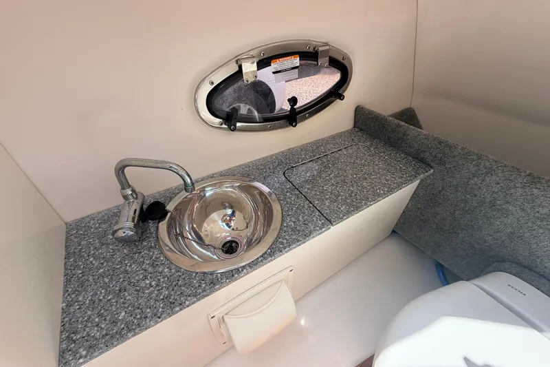 Slide: The Image of 2016 Chaparral 250 Suncoast boat interior with sink and countertop. - 43