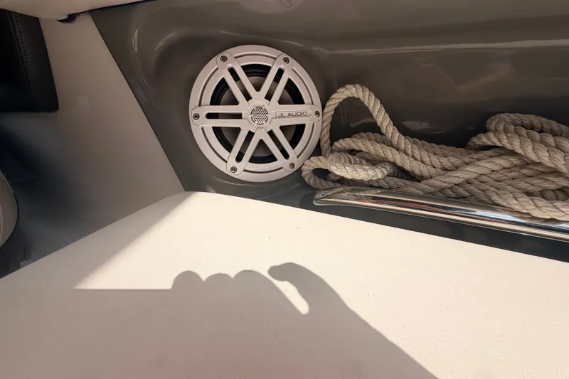 Slide: The Image of Speaker and rope on 2016 Chaparral 250 Suncoast boat interior. - 37