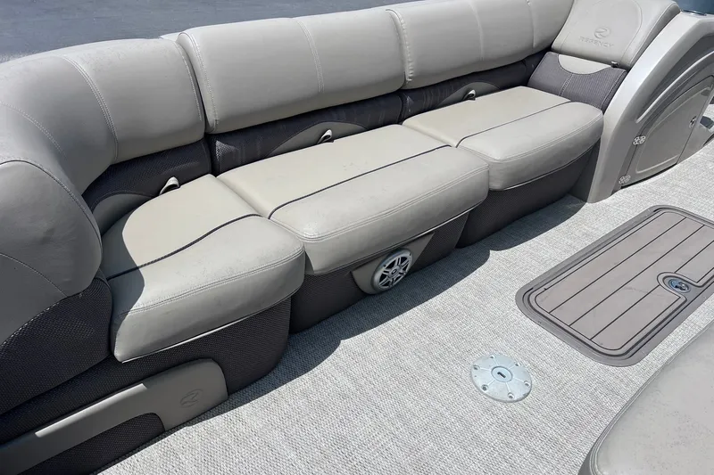 Slide: The Image of Luxurious seating on a 2020 Regency 250 DL3 pontoon boat, featuring plush gray upholstery. - 10