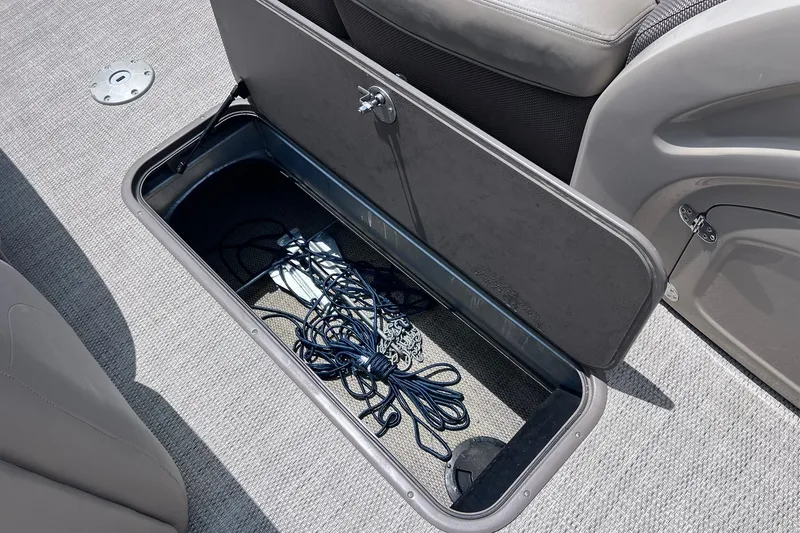 Slide: The Image of Open storage compartment on 2020 Regency 250 DL3 boat with ropes inside. - 23