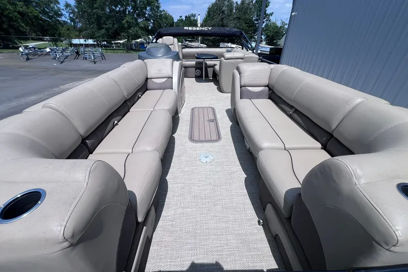 Slide: The Image of Luxurious 2020 Regency 250 DL3 pontoon boat with spacious seating and elegant design. - 9