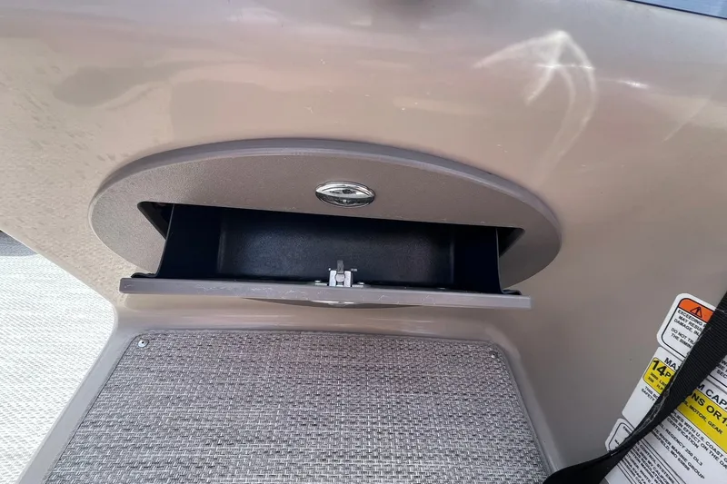 Slide: The Image of Open storage compartment on 2020 Regency 250 DL3 boat interior. - 21