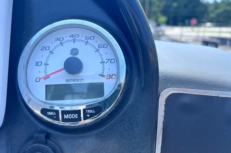 Slide: The Image of Speedometer of 2020 Regency 250 DL3 boat, showing speed and troll mode controls. - 18