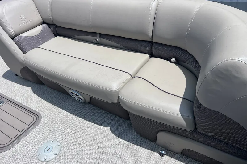 Slide: The Image of 2020 Regency 250 DL3 boat seating with beige upholstery and integrated speaker. - 11