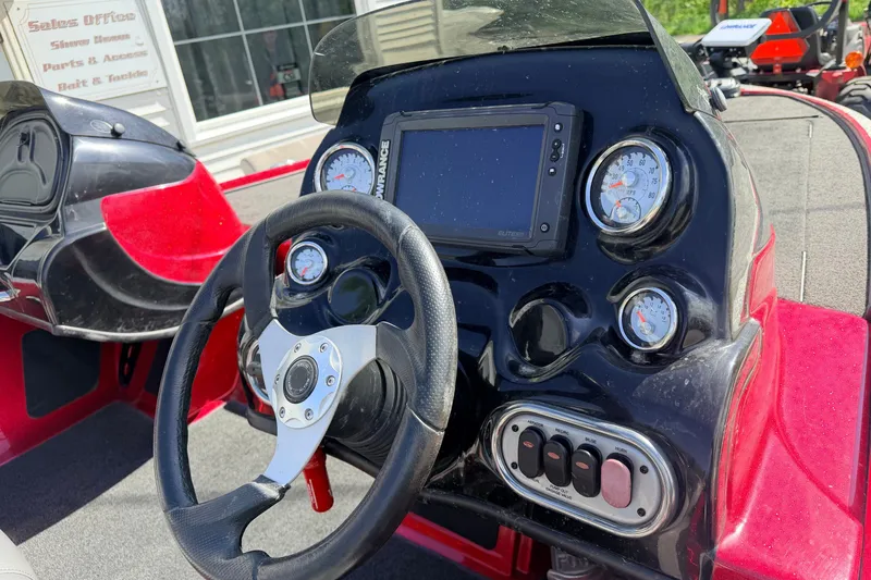 Slide: The Image of Dashboard of a 2015 Nitro Z-7 boat with steering wheel and gauges. - 4