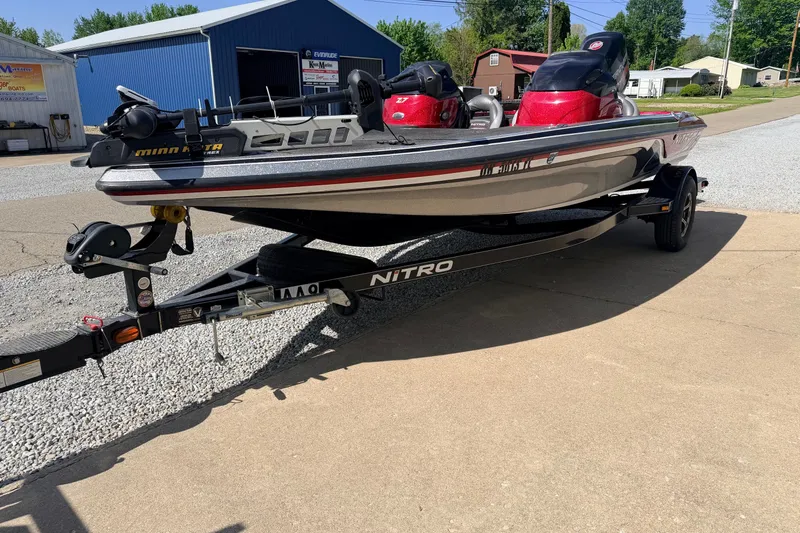 Slide: The Image of 2015 Nitro Z-7 boat on trailer, parked outdoors near blue building. - 10