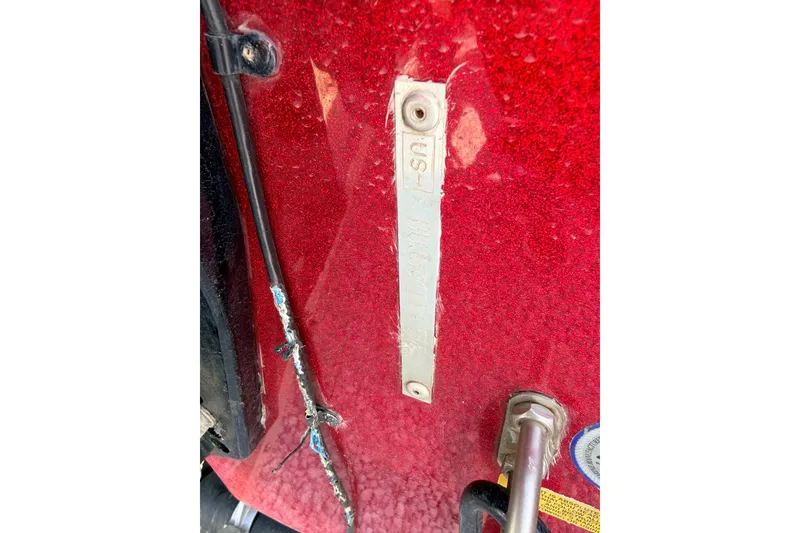 Slide: The Image of Red Nitro Z-7 boat, 2015 model, with identification plate and wiring visible. - 12