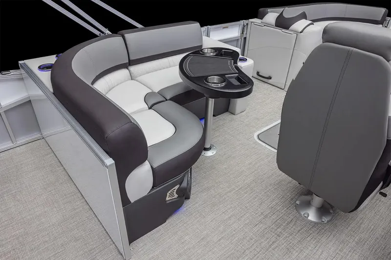 Slide: The Image of Manufacturer Provided Image: 2025 Tahoe Pontoon Cascade Rear Fish interior with plush seating and table. - 6
