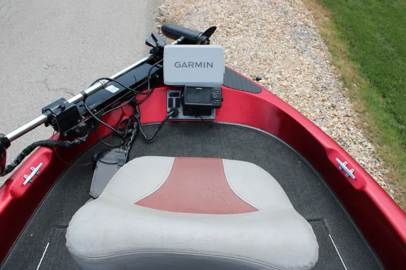 Slide: The Image of 2006 Triton 190FS boat interior with Garmin navigation system and cushioned seat. - 8