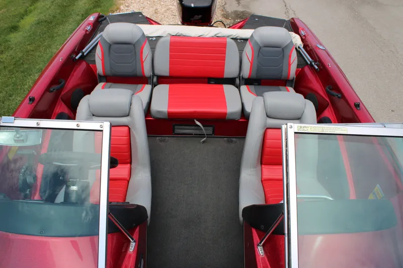 Slide: The Image of 2006 Triton 190FS boat interior with red and gray seating, viewed from above. - 6