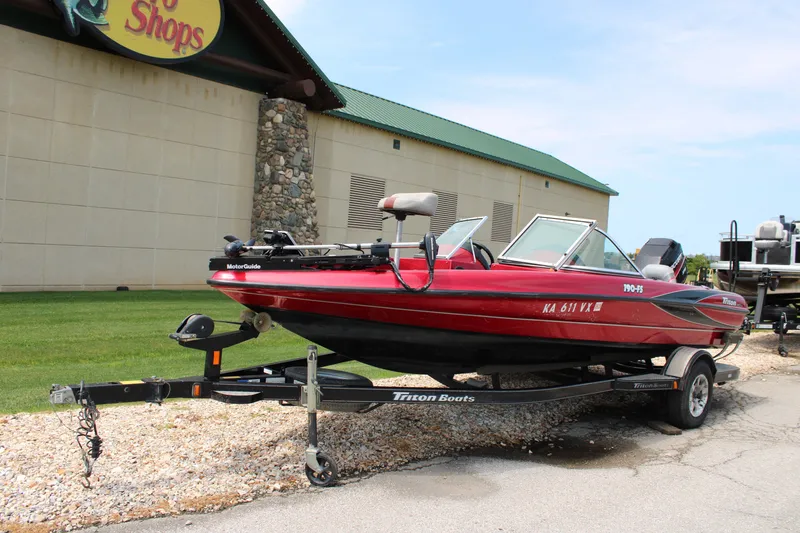 Slide: The Image of 2006 Triton 190FS boat on trailer outside Bass Pro Shops. - 3
