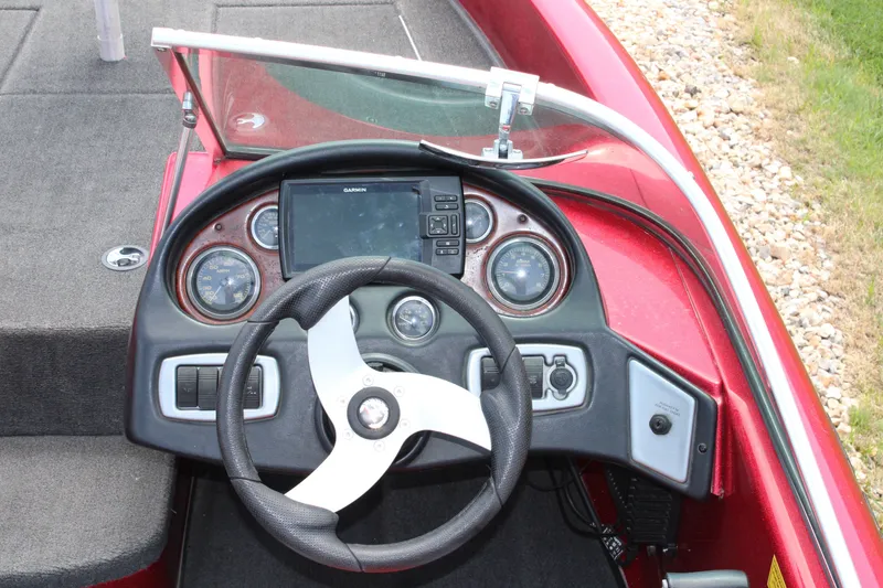 Slide: The Image of Steering console of a 2006 Triton 190FS boat with gauges and GPS display. - 9