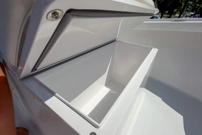 Slide: The Image of Open storage compartment on a 2025 Weaver 25 boat, showcasing sleek design. - 14