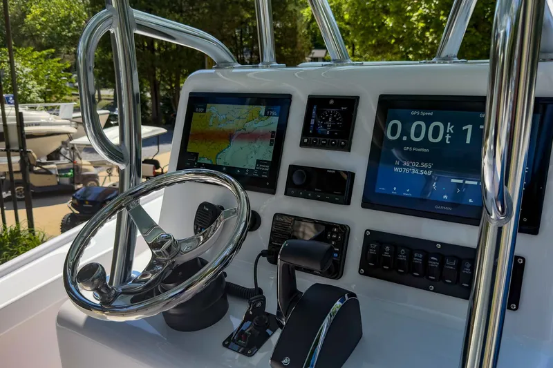 Slide: The Image of Control panel of a 2025 Weaver 25 boat with GPS and navigation screens. - 6