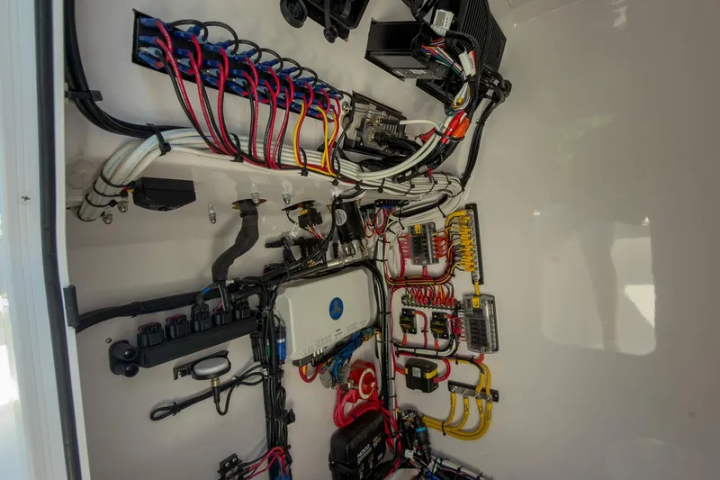 Slide: The Image of Electrical wiring system inside Weaver 25 model, 2025, showcasing organized cables and components. - 11