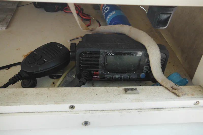 Slide: The Image of VHF marine radio in a 2001 Sea Pro 235 Center Console boat compartment. - 15