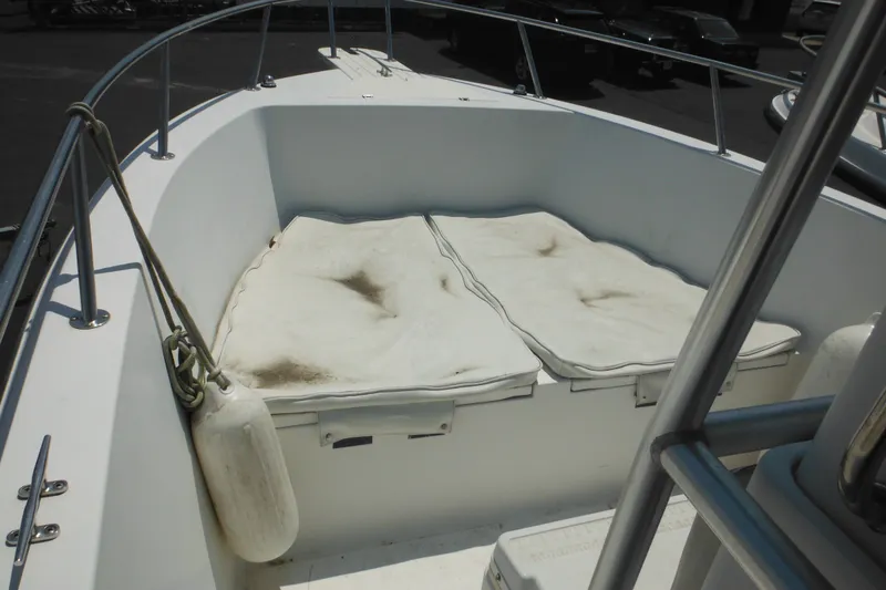 Slide: The Image of 2001 Sea Pro 235 Center Console boat with cushioned seating and railing. - 16