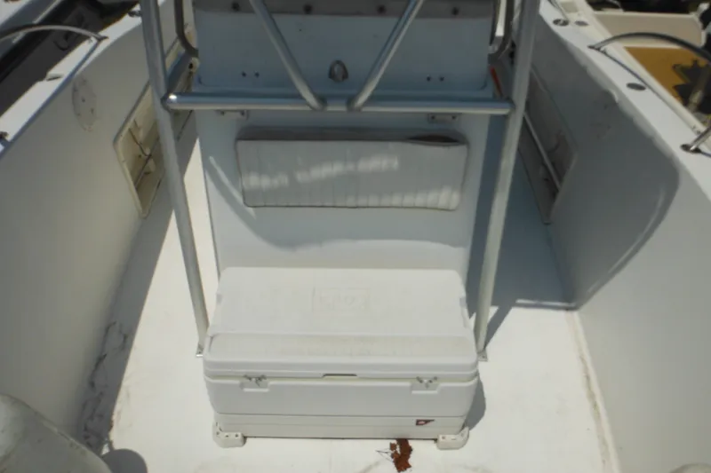 Slide: The Image of 2001 Sea Pro 235 Center Console interior with seating and storage area. - 27