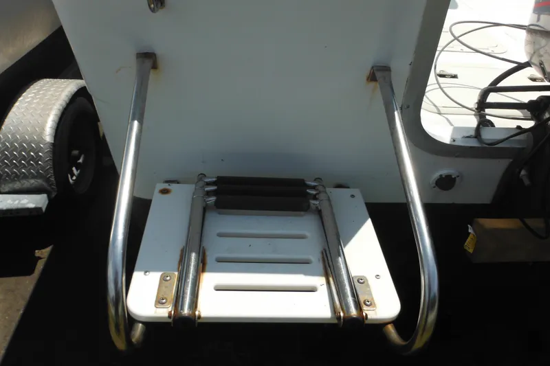 Slide: The Image of 2001 Sea Pro 235 Center Console boat ladder with stainless steel rails. - 29
