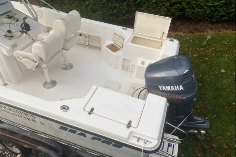 Slide: The Image of 2001 Sea Pro 235 Center Console boat with Yamaha outboard motor, white interior. - 32
