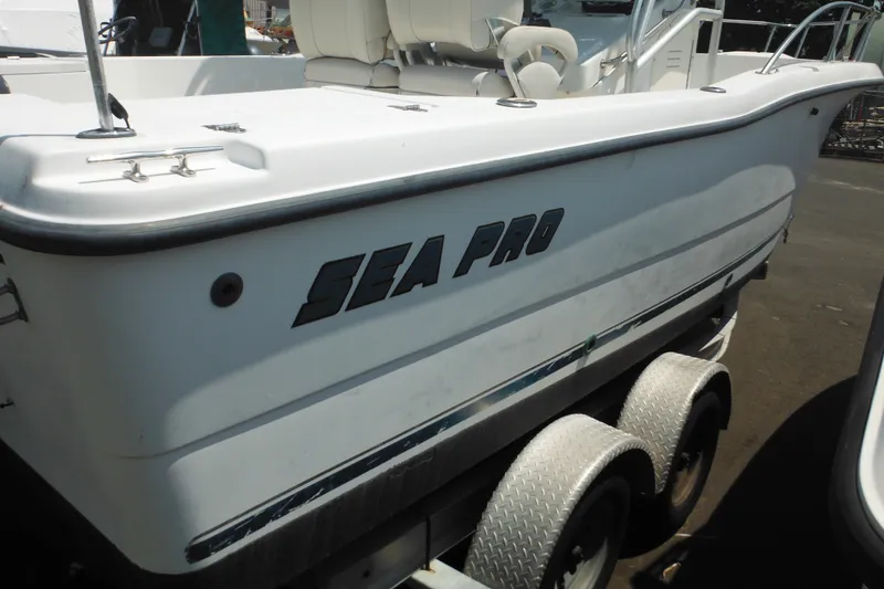 Slide: The Image of 2001 Sea Pro 235 Center Console boat on a trailer, side view. - 7