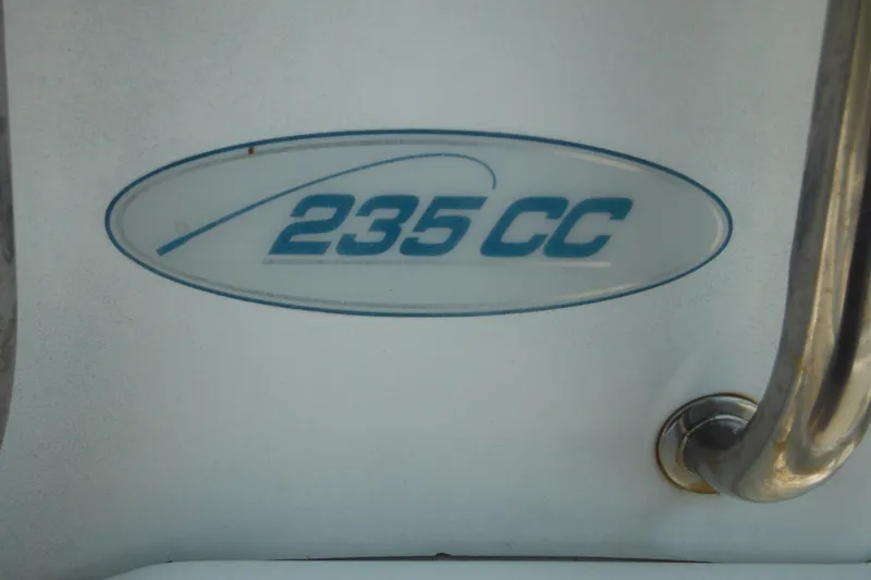 Slide: The Image of Sea Pro 235 Center Console 2001 model emblem on boat surface. - 20