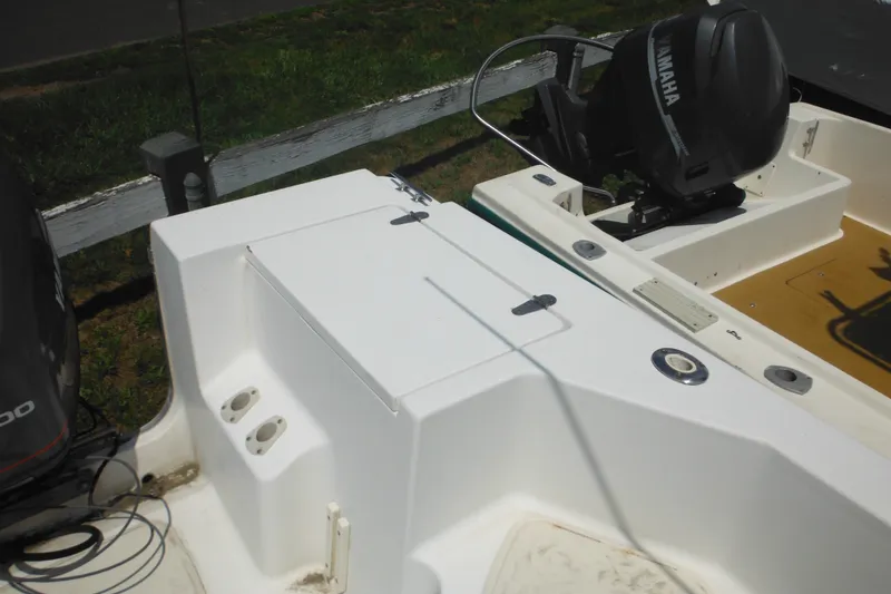 Slide: The Image of 2001 Sea Pro 235 Center Console boat with Yamaha outboard motor, docked outdoors. - 12