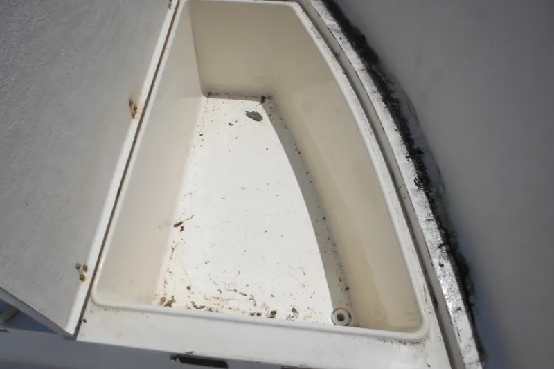 Slide: The Image of Storage compartment of 2001 Sea Pro 235 Center Console boat, showing interior details. - 24