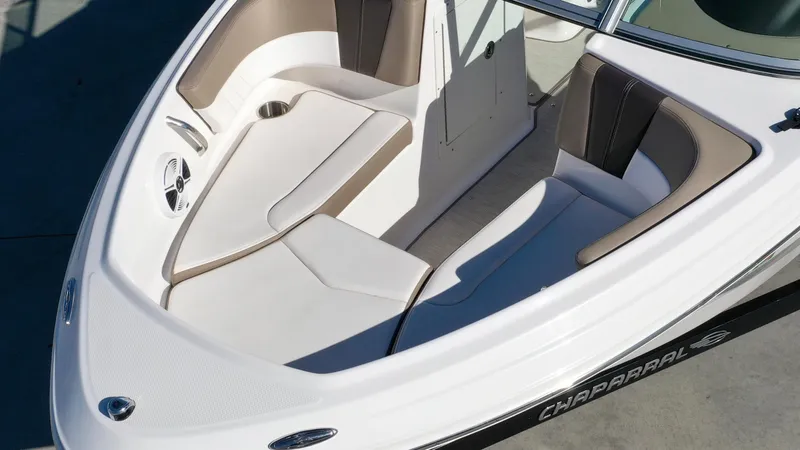 Slide: The Image of The image shows the bow layout of a Chaparral 19 SSi boat with beige and white upholstery. - 11