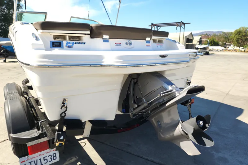 Slide: The Image of 2020 Chaparral 19 SSi boat on trailer, rear view with propeller visible. - 14