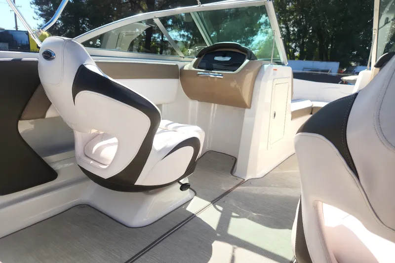 Slide: The Image of 2020 Chaparral 19 SSi boat interior with modern seating and dashboard design. - 18