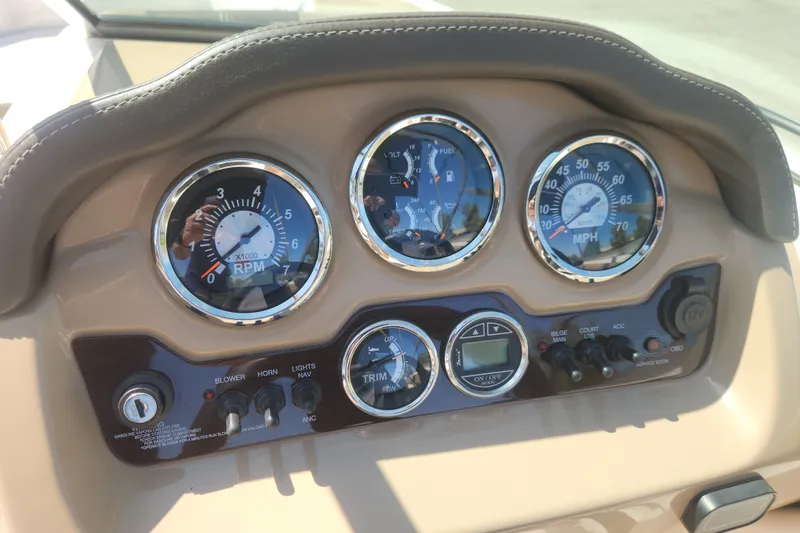 Slide: The Image of Dashboard of a 2020 Chaparral 19 SSi boat with gauges and controls. - 21
