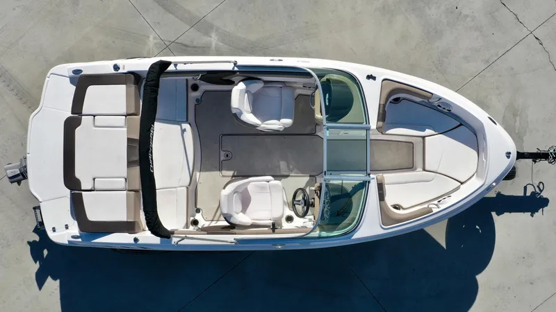 Slide: The Image of Aerial view of a 2020 Chaparral 19 SSi with a white hull and two seats in the cockpit. - 9