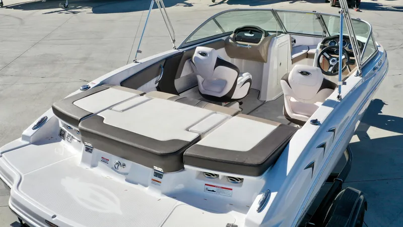 Slide: The Image of The image shows a 2020 Chaparral 19 SSi boat with modern seating and sleek design. - 8