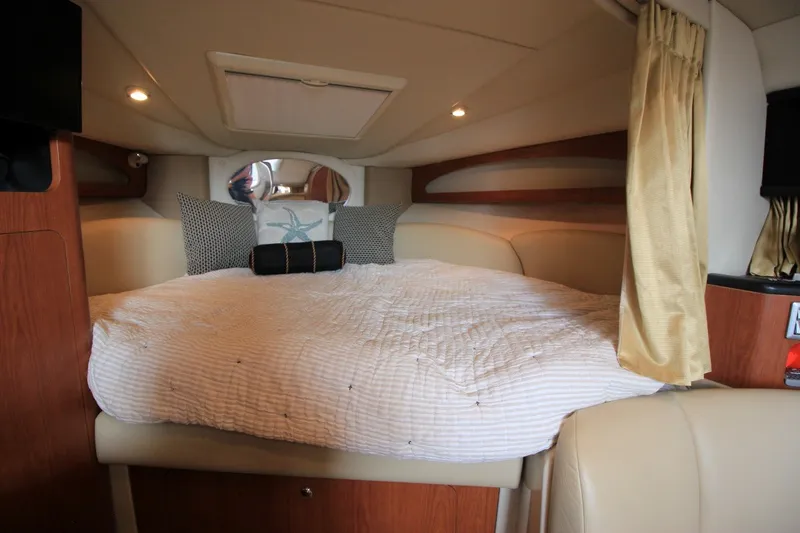 Slide: The Image of Interior cabin of 2004 Chaparral Signature 310 with cozy bed and elegant decor. - 17