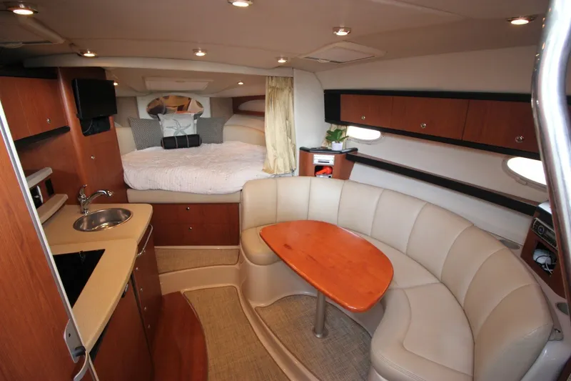 Slide: The Image of Luxurious interior of 2004 Chaparral Signature 310 yacht with cozy seating and kitchenette. - 14