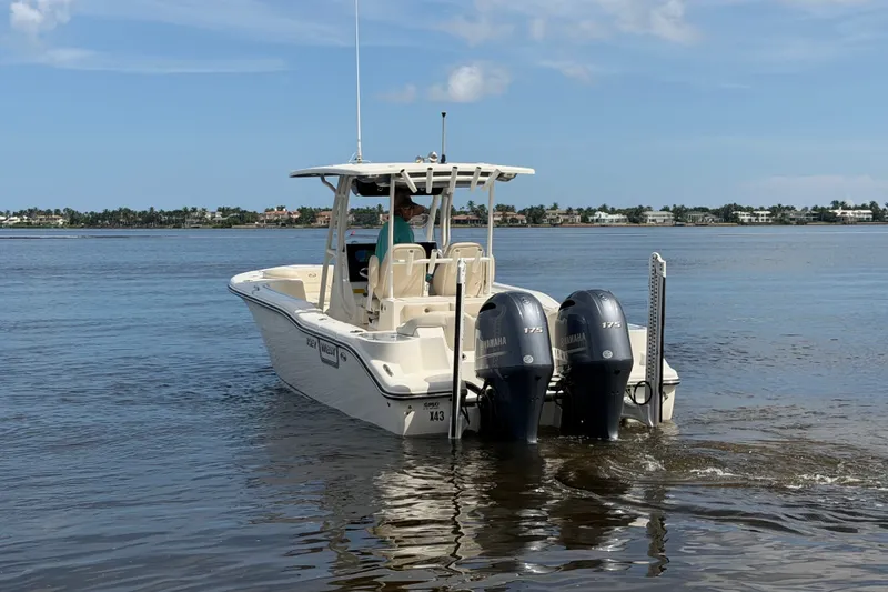 Slide: The Image of 2022 Key West 263 FS boat with dual Yamaha engines on calm water. - 20