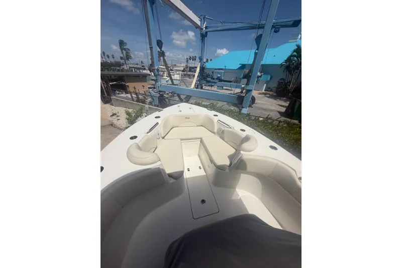 Slide: The Image of 2022 Key West 263 FS boat interior with seating, dockside view. - 4