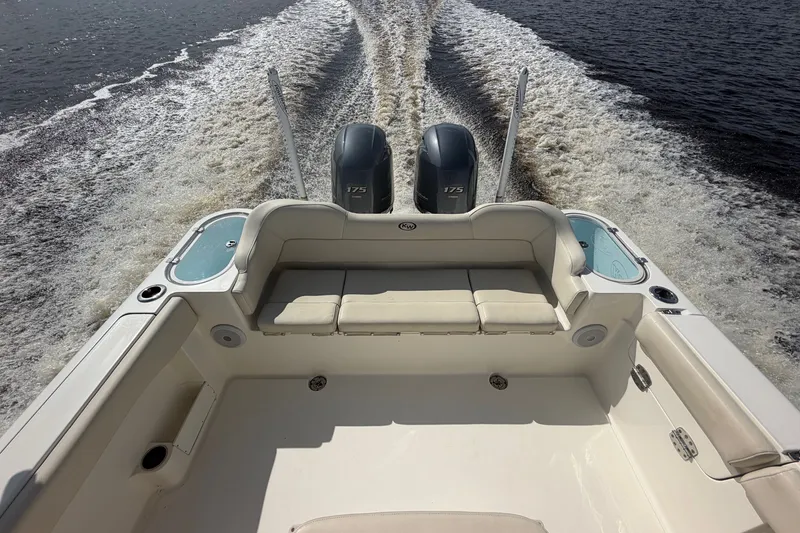 Slide: The Image of 2022 Key West 263 FS boat with dual engines cruising on water. - 4