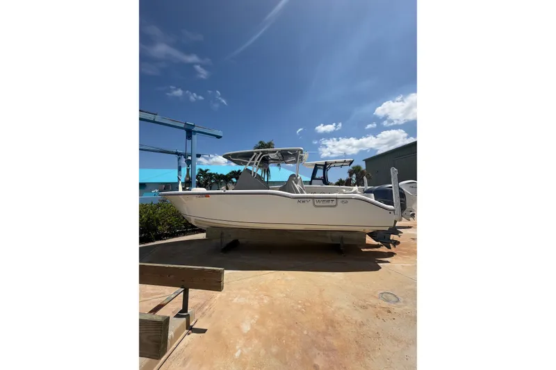 The Image of 2022 Key West 263 FS boat on display under a clear blue sky. - 1