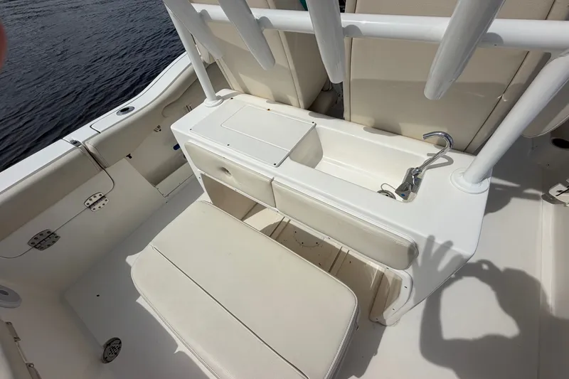 Slide: The Image of 2022 Key West 263 FS boat interior with seating and storage compartments. - 10