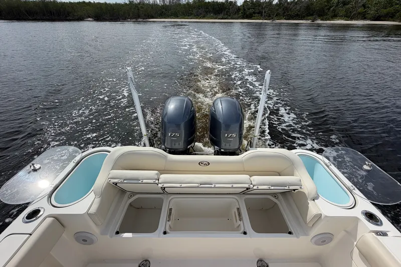Slide: The Image of 2022 Key West 263 FS boat with dual engines cruising on water. - 5