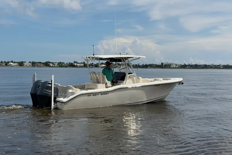 Slide: The Image of 2022 Key West 263 FS boat cruising on calm waters under a clear sky. - 23